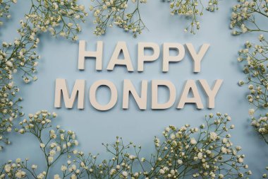 Happy Monday alphabet letters on blue background