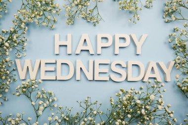 Happy Wednesday alphabet letters on blue background