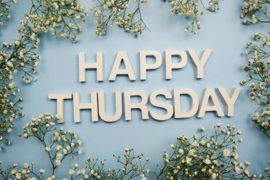 Happy Thursday alphabet letters on blue background