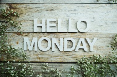Top View of Hello Monday alphabet letters on wooden background