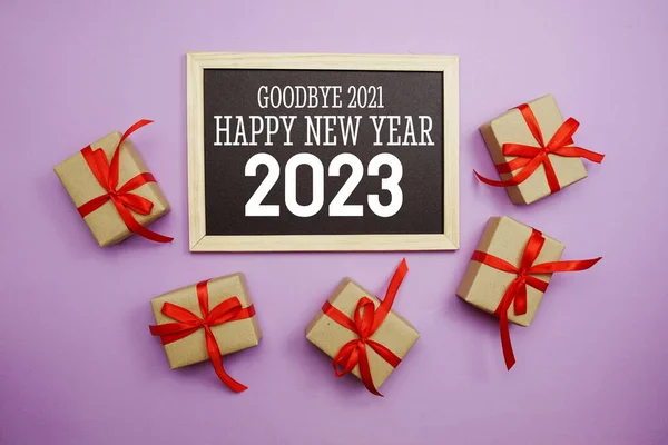 Happy New Year 2023 Typography Text Gift Box Purple Background — Zdjęcie stockowe
