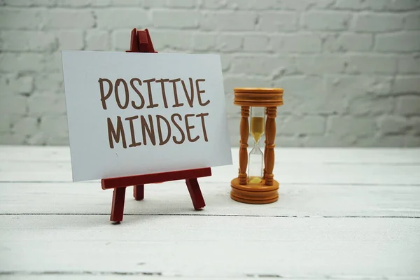 Positive Mindset Text Sandglass White Brick Wall Wooden Background — Stock fotografie