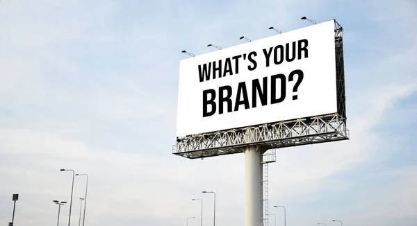 What\'s you brand? text message on signboard with blue sky