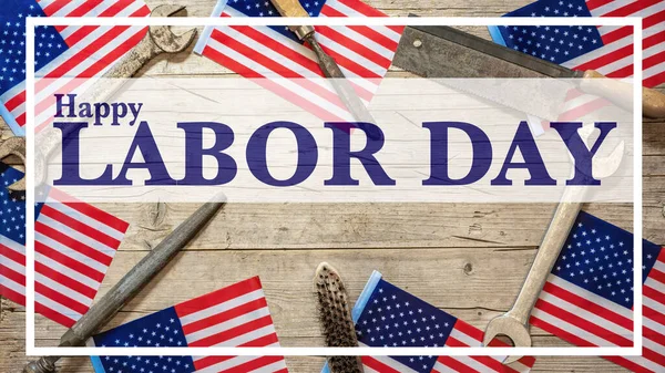 Happy Labor Day background banner greting card template - American flags and working tool , isolated on rustic wood texture, wooden table, top view