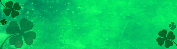 Good luck background banner panorama template - Abstract green texture with bokeh lights and four leaf clover