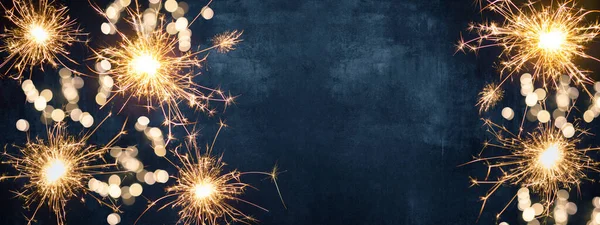 HAPPY NEW YEAR 2022 background greeting card - Firework, sparklers and bokeh lights and sparklers on dark blue night sky