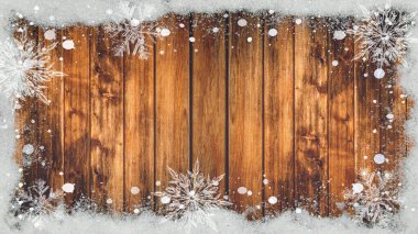 Kış / Advent / Advents Arkaplan şablonu - Kar taneleri ve kahverengi ahşap doku üzerindeki buz kristalleri ile kardan yapılmış çerçeve, metin için boşluk ile üst görünüm