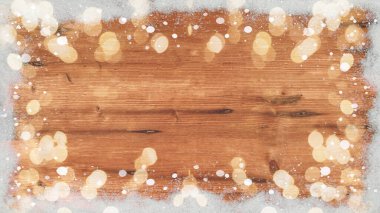Kış / Advent / Noel Şablonu - Kar taneli kardan yapılmış çerçeve ve kahverengi ahşap desenli bokeh ışıkları, metin alanı için üst görünüm