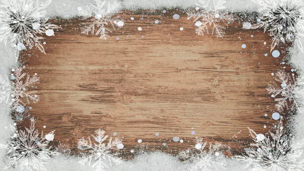 アドベント クリスマス背景テンプレート 茶色の木のテクスチャに雪のフレークと氷の結晶で作られたフレーム テキストのためのスペースとトップビュー — ストック写真