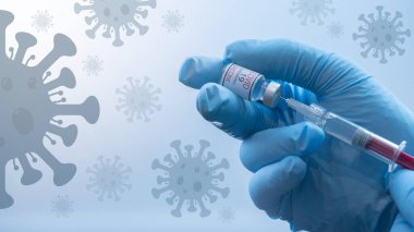CORONAVIRUS COVID-19 / CORONA VACCINASYONU - Doktorun elinde şırınga ve Corona aşısı var