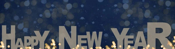 Yeni Yıl Mektupları Altın Bokeh Işıkları Koyu Mavi Kar Taneleriyle — Stok fotoğraf