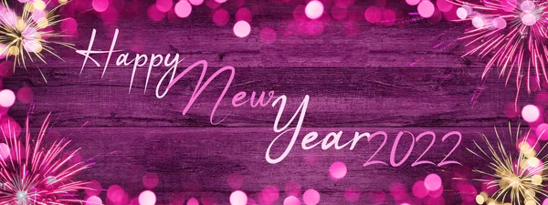 ライトのフレームは 素朴な抽象的なピンクの木のテクスチャに隔離された黄金のフレアや花火をボケ ホリデー大晦日シルベスター新年パーティー花火の背景バナーグリーティングカード — ストック写真
