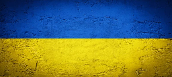 要約コンクリートの石の壁のテクスチャの背景 ウクライナの旗の色で — ストック写真