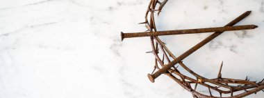 Crucifixion Of Jesus / religion easter background - Crown Of Thorns and rusty old nails on white marble marble Ground or table or altar clipart