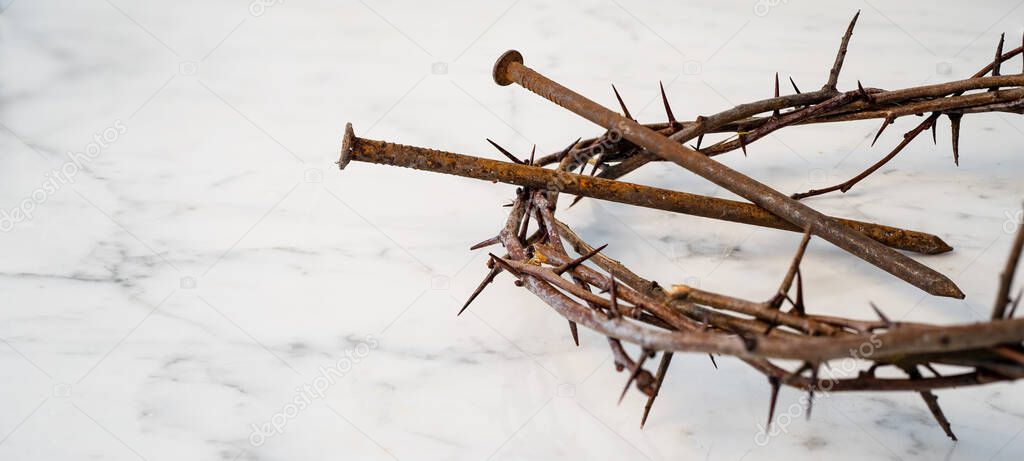 Crucifixion Of Jesus / religion easter background - Crown Of Thorns and rusty old nails on white marble marble Ground or table or altar