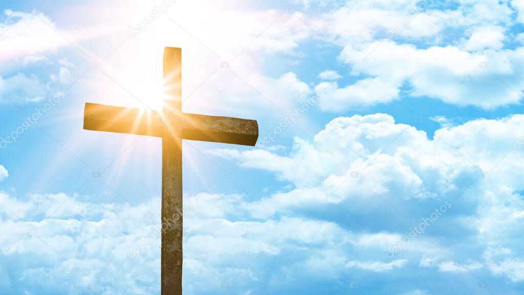 Religious Background - Old steel cross with blue sky, clouds and sunbeams