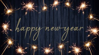 Mutlu yıllar 2023 Silvester Partisi bayram arkaplan bayramı tebrik kartı - Kırsal mavi ahşap masa dokusu, parıldayan maytaplardan yapılmış çerçeveli, metin için yeri olan