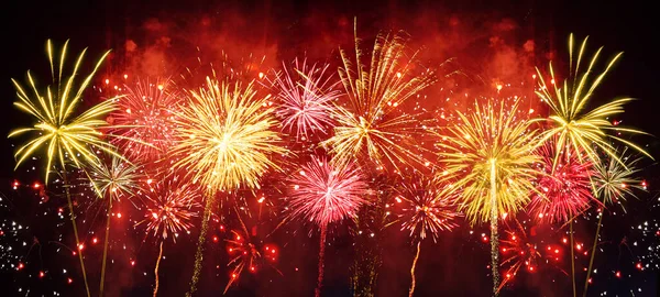 HAPPY NEW YEAR 2023 - Celebration New Year's Eve, Silvester 2023 holiday background panorama greeting card - Golden firework fireworks pyrotechnics on dark night sky