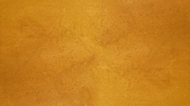 Abstract yellow golden marbled spotted stone wall texture background