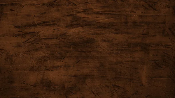 Old brown rustic scratched dark grunge wooden timber wall or floor or table texture - wood background banner