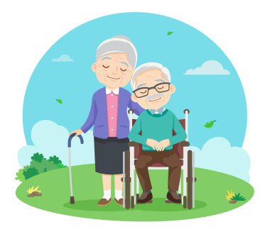 Tekerlekli sandalyede oturan sevimli yaşlı çift parkta rahatlıyor.
