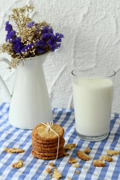 Oat cookies with milk and flowers