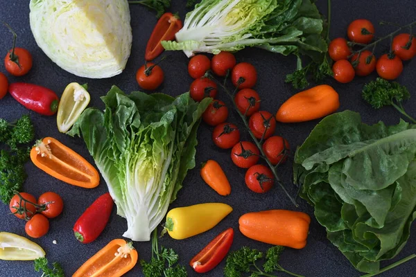 fresh vegetables on a black background. top view