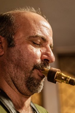 Cuenca, Ecuador, Dec 4, 2021 - Man plays Saxaphone