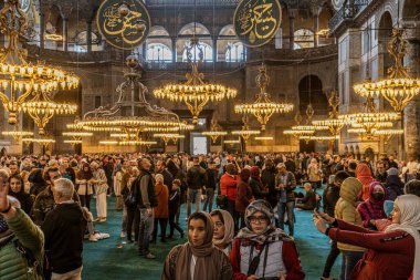 Istanbul, Turkey - April 29, 2022 - Tourists and Pilgrims in the Hagia Sophia Mosque. High quality photo