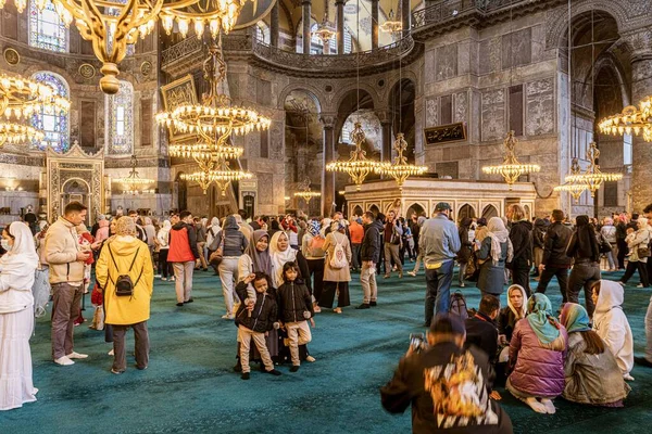 Istanbul, Turkey - April 29, 2022 - Tourists and Pilgrims in the Hagia Sophia Mosque. High quality photo