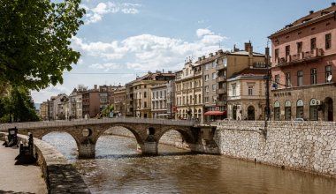 Sarajevo, Bosnia - May 2, 2022 - Library building was the City Hall before The War, and the Latin Bridge.