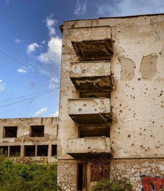 Sarajevo, Bosnia - May 2, 2022 - Bullet ridden buildings from The Bosnian War.