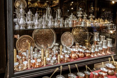 Sarajevo, Bosnia - May 2, 2022 - Copper, silver and brass tableware for sale in shop.