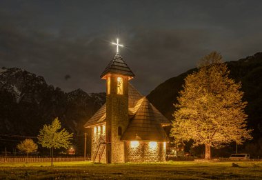 Theth, Albania, May 12, 2022 - small stone church at night
