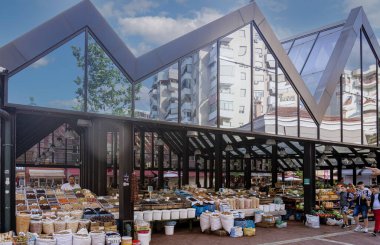 Albania, May 12, 2022 - street market with large reflective glass cover.