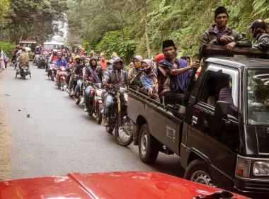 Indonesia, June 13 2022 - Rural traffic jams of both cars and motorcycles are common in Indonesia.