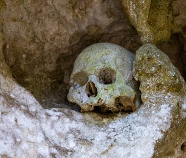 Indonesia, June 13 2022 - Skulls in Londa Burial Caves guard the caskets of those dead for hundreds of years.