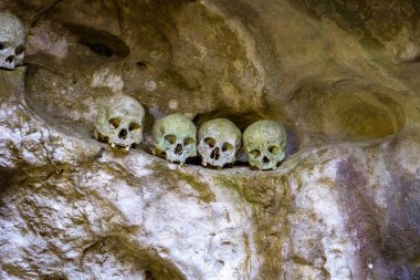 Indonesia, June 13 2022 - Skulls in Londa Burial Caves guard the caskets of those dead for hundreds of years.
