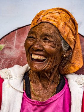 Indonesia, June 13 2022 - Old woman smailes when talking.