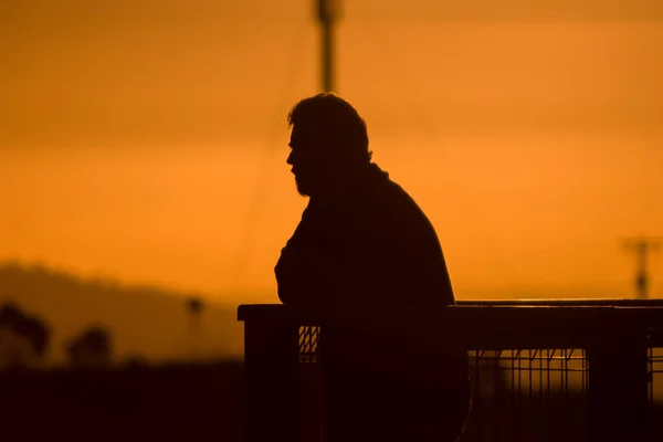 Silhouette Man Beard Sunset Leaning Fence Looking Out View — Stock Photo, Image