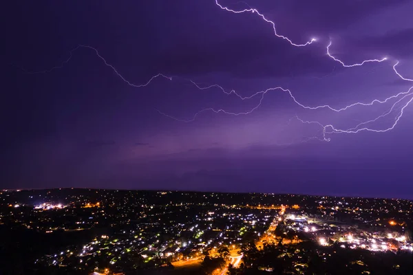 Lightning Bolt Discharging Stormy Clouds Street Lights Aerial Nighttime Shot — Stock Photo, Image
