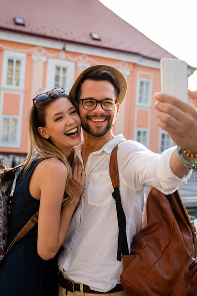 Portrait of happy young couple having date and fun on vacation. People travel happiness concept.