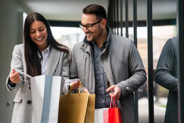 Beautiful Young Couple Carrying Bags Enjoying Together Christmas Shopping Sale — Stock Photo, Image