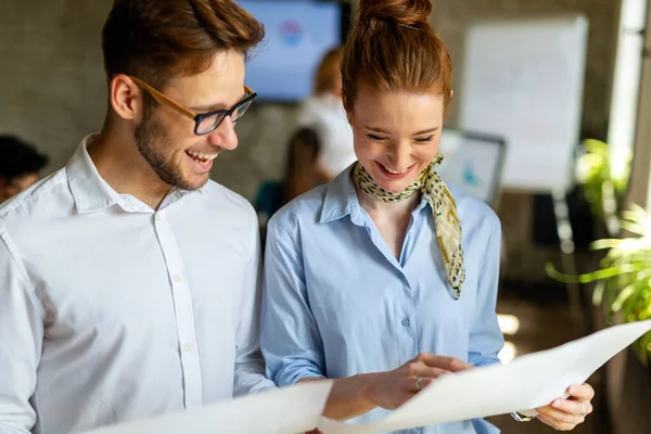 Portrait Two Young Business People Talking Documents Office Business Startup — Zdjęcie stockowe