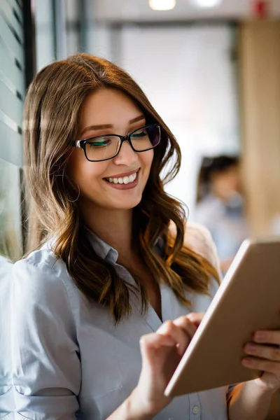 Happy Young Businesswoman Using Digital Tablet While Standing Front Windows — Stock Photo, Image