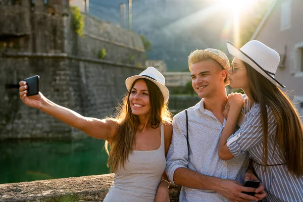 Group of happy friends enjoying travel and summer vacation together. People student friend travel concept.