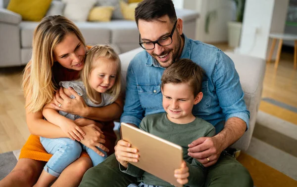 Happy Young Family Having Fun Time Home Parents Children Using — Stockfoto