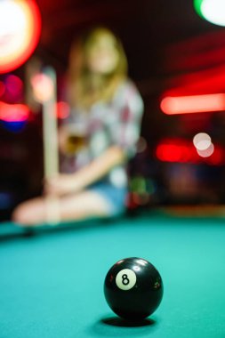 8 Ball from pool or billiards on a billiard table. People entertainment game fun concept
