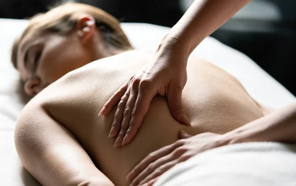 Healthy and beautiful woman in spa. Recreation, health, massage and healing.