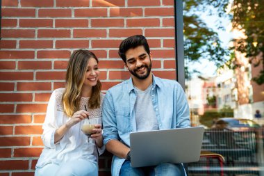 Happy young success people working, studying together with digital devices. Business education technology people concept